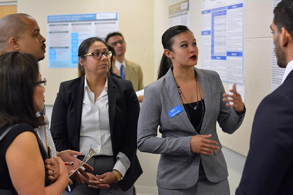 student presenting poster