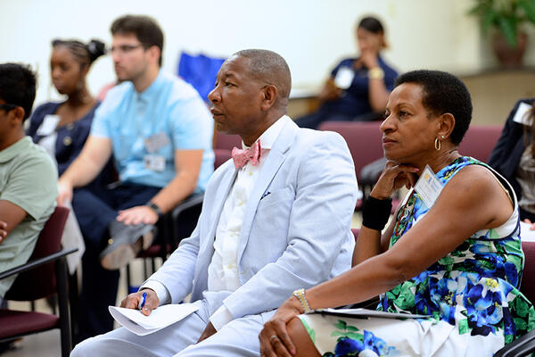 Dean Deas and audience paying attention to presentation