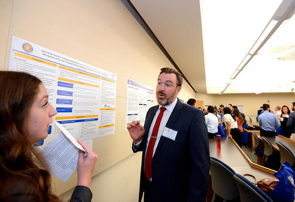 Student Presenting Poster