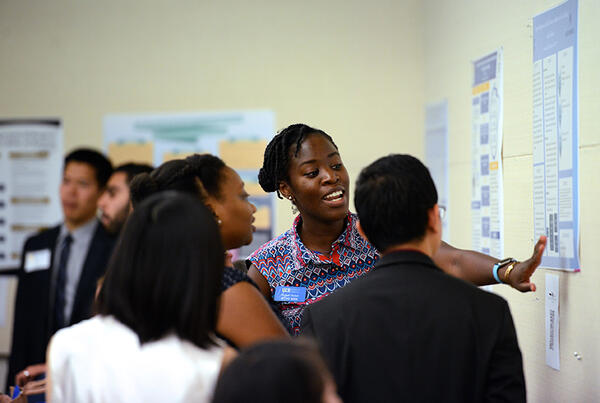 student presenting poster